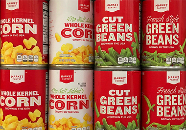 Stacks of can corn and can green beans